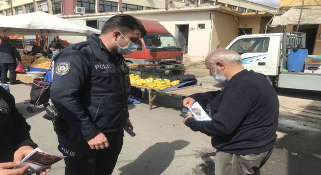 Polisten pazar yerinde dolandırıcılara karşı uyarı