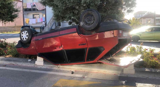 Takla atan otomobilden burnu bile kanamadan kurtuldu