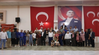 Adana’da MHP’ye katılan 300 kişiye törenle rozet takıldı