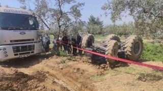 Bursada sürücü devrilen traktörün altında can verdi