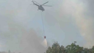 Kontrol altına alınan yangına helikopterler ile müdahale ediliyor