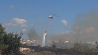 Avcılarda otluk alanda çıkan yangın helikopter yardımıyla söndürüldü