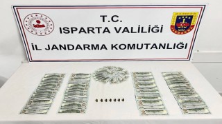 Ispartada piyasaya sahte dolar sürmek üzere olan 3 şahıs yakalandı