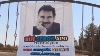 Mezarlık duvarına terörist başı Öcalanın posteri asıldı