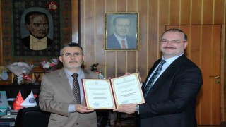 Prof. Dr. Hüseyin Baydemire Özbekistanda nişan ve fahri profesörlük verildi
