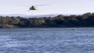 Helikopter ile kayık gölette karşılaştı