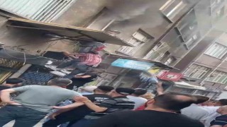 Bursada evde çıkan yangında alevlerin arasında kalan kadını mahalleli kurtardı