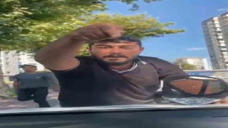 Cam silme bahanesiyle aracın kaputuna yatıp zorla para istemişti, tutuklandı