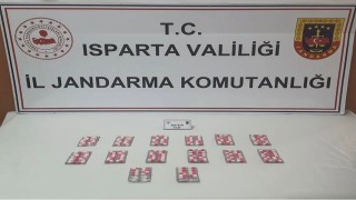 Ispartada yol kontrolünde durdurulan araçta uyuşturucu hap ele geçirildi