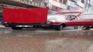 Sinopta yanan otomobile esnafın müdahalesi faciayı önledi
