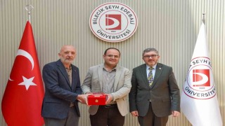 BŞEÜye gümüş madalya ve madalya beratı takdimi