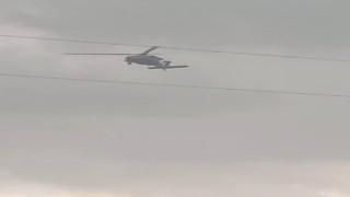 Askeri helikopter dolu ve yağmura yakalandı
